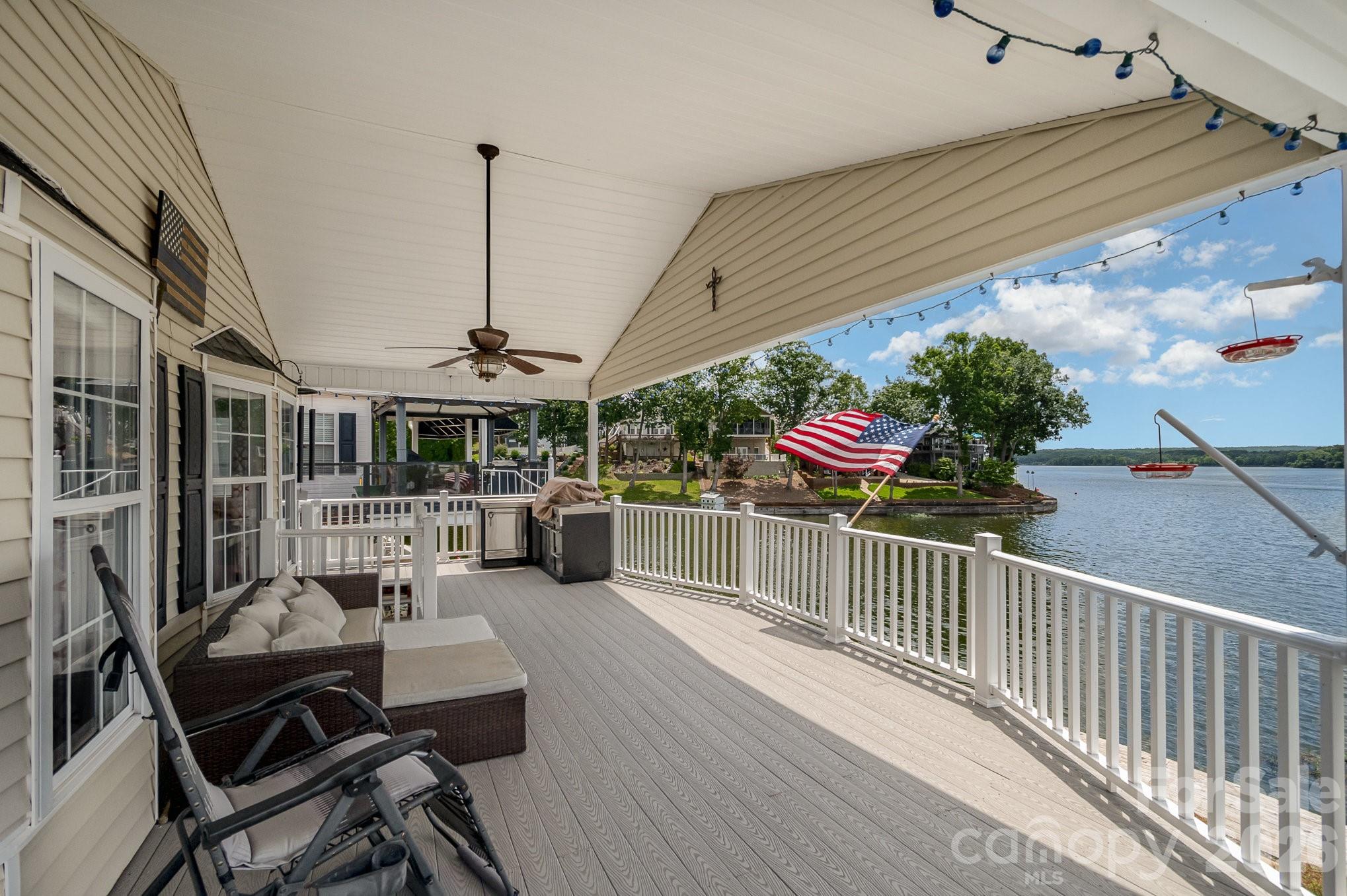 141 Badin Lake Road New London, NC 28127 - Photo 18 of 47 a view of a chairs and table in the balcony