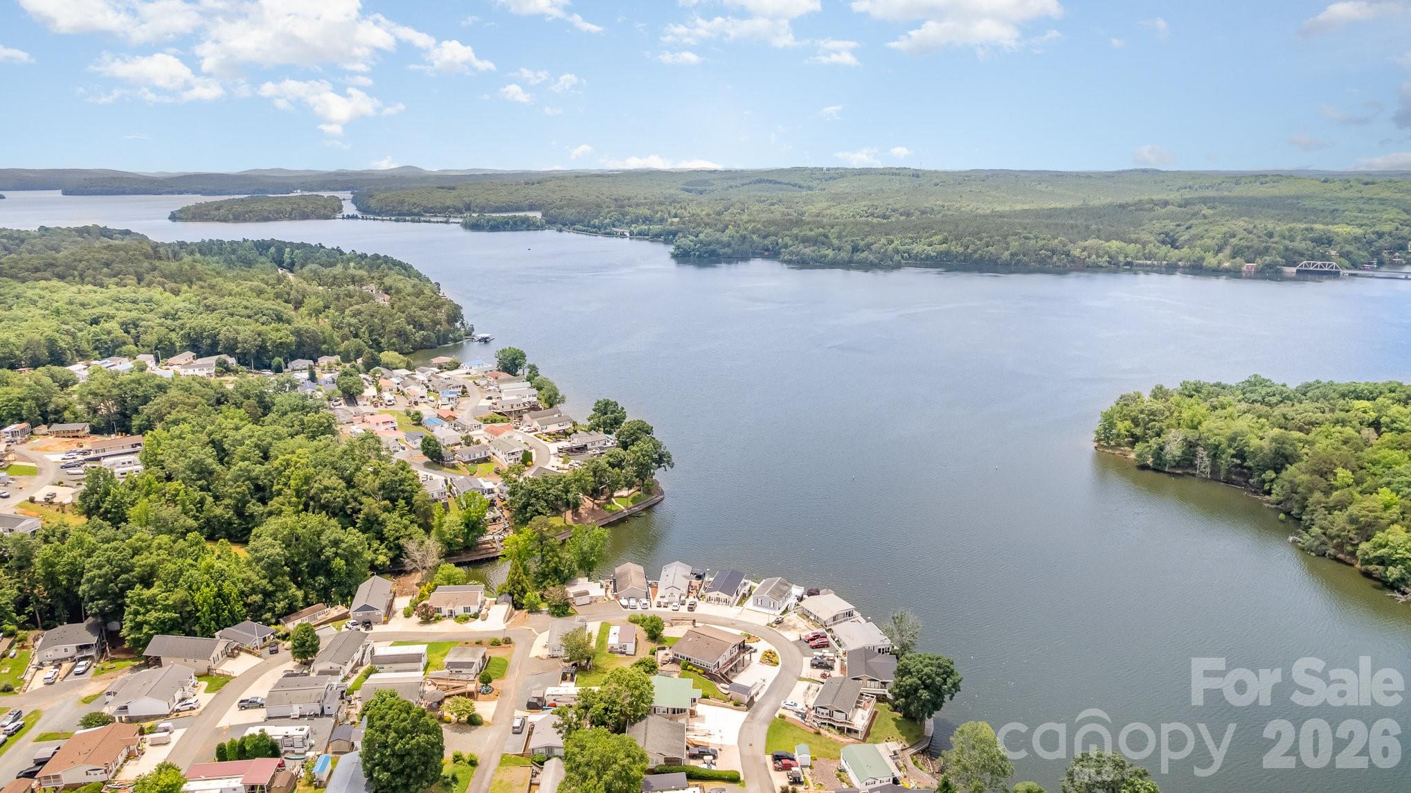 141 Badin Lake Road New London, NC 28127 - Photo 23 of 47 a view of a lake with a mountain