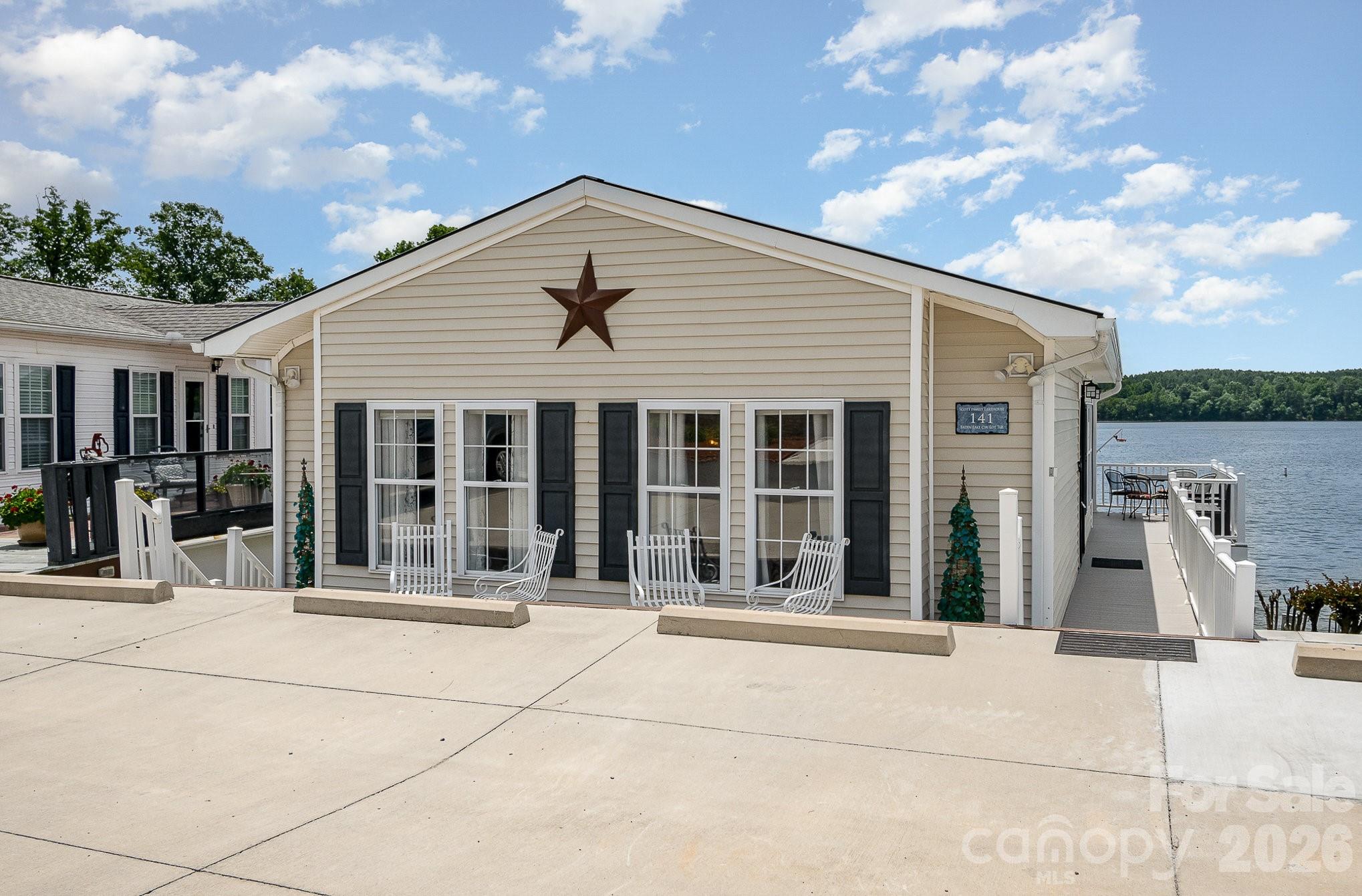 141 Badin Lake Road New London, NC 28127 - Photo 3 of 47 a front view of a house with a porch