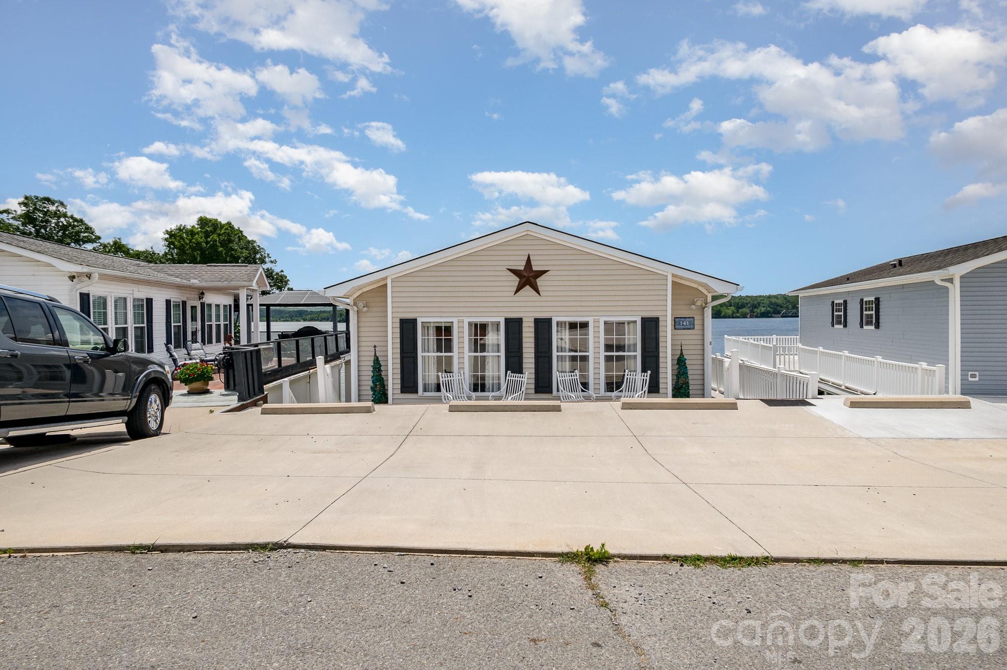 141 Badin Lake Road New London, NC 28127 - Photo 4 of 47 a view of a large white house