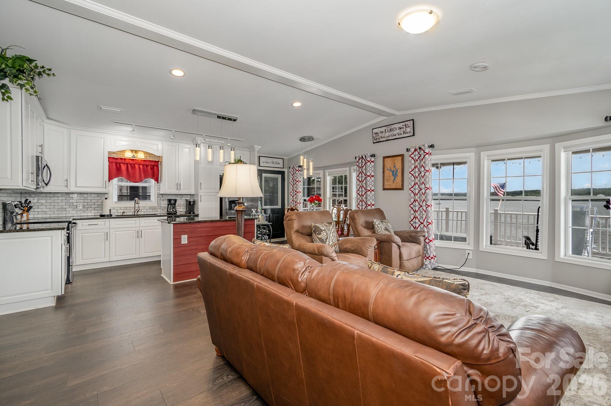 141 Badin Lake Road New London, NC 28127 - Photo 6 of 47 a living room with furniture kitchen and a large window