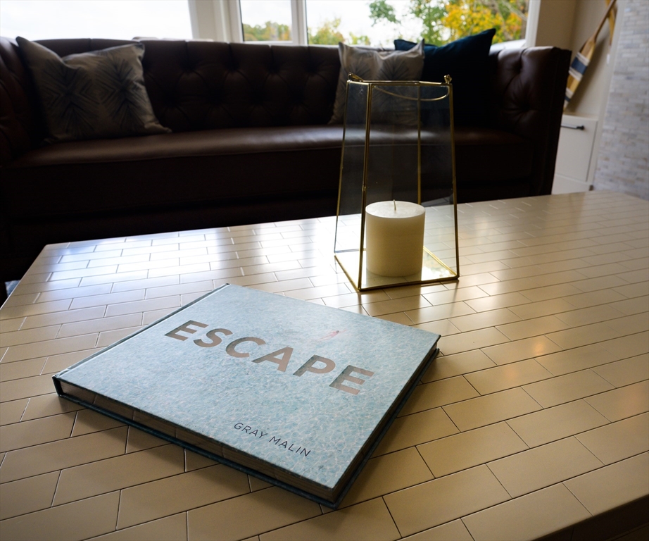 130 Chief Justice Cushing Highway, Unit 213 Scituate, MA 02066 - Photo 17 of 40 a view of a couch in a living room