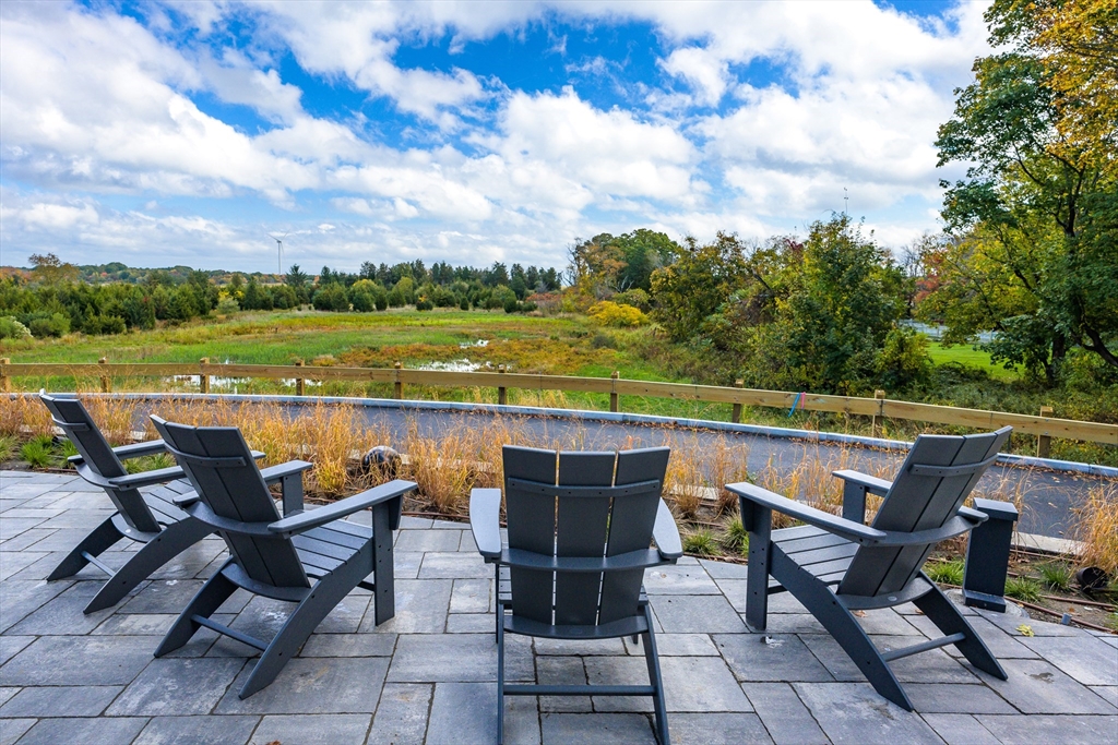 130 Chief Justice Cushing Highway, Unit 213 Scituate, MA 02066 - Photo 22 of 40 a view of a outdoor space with furniture