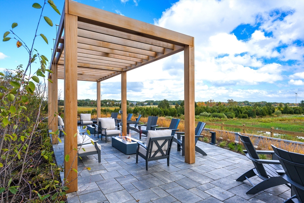 130 Chief Justice Cushing Highway, Unit 213 Scituate, MA 02066 - Photo 23 of 40 a view of outdoor space with furniture