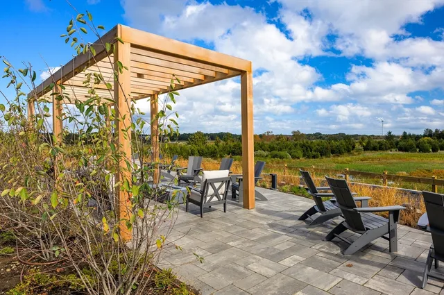 a view of a building with sitting area