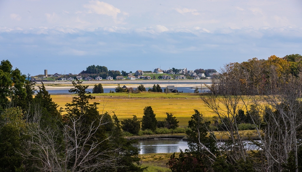 130 Chief Justice Cushing Highway, Unit 213 Scituate, MA 02066 - Photo 35 of 40 a view of a lake with a city