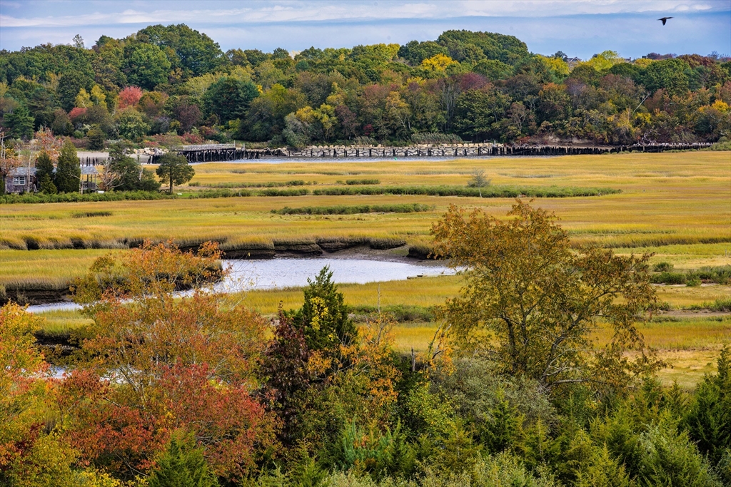 130 Chief Justice Cushing Highway, Unit 213 Scituate, MA 02066 - Photo 36 of 40 a view of a lake with a houses
