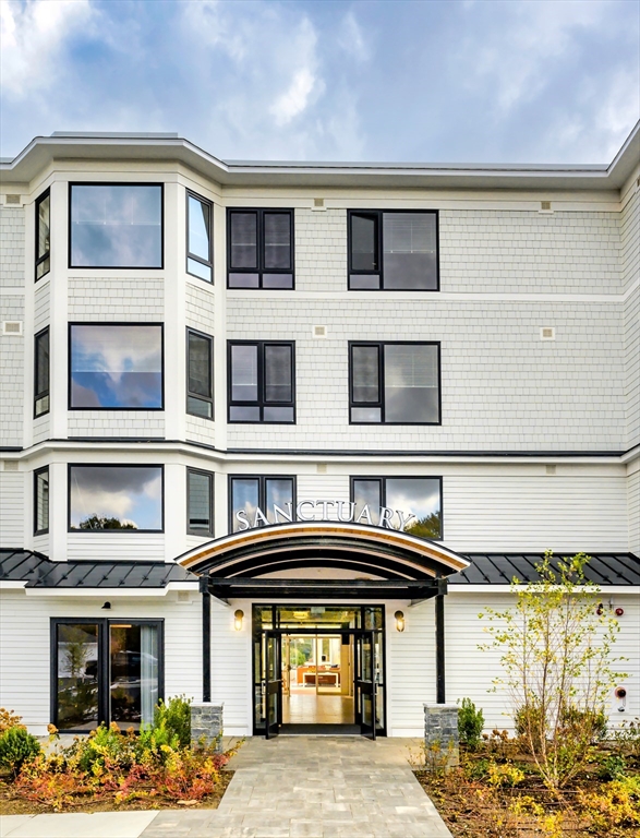 130 Chief Justice Cushing Highway, Unit 213 Scituate, MA 02066 - Photo 40 of 40 a front view of a multi story building