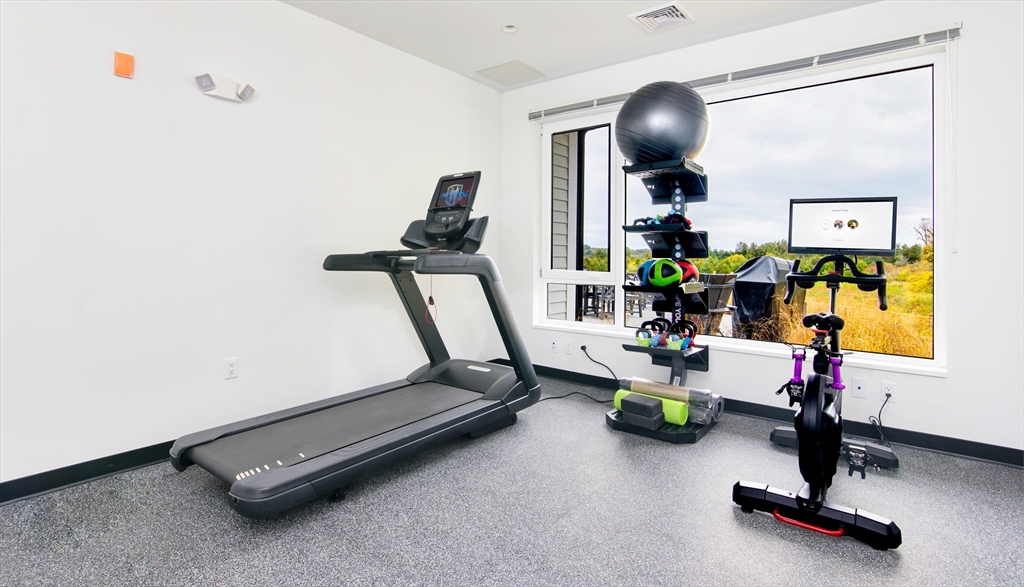 130 Chief Justice Cushing Highway, Unit 213 Scituate, MA 02066 - Photo 7 of 40 a room with gym equipment