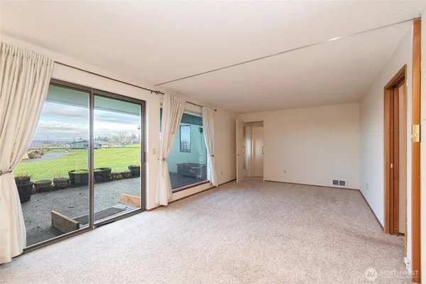 a view of an empty room and window