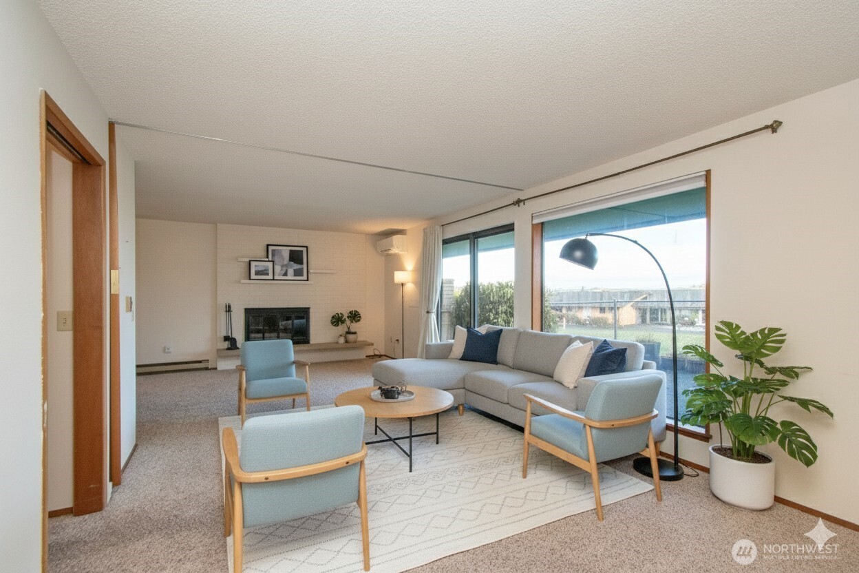 1301 South 3rd Avenue, Unit 9B Sequim, WA 98382 - Photo 15 of 39 a living room with furniture potted plant and a large window