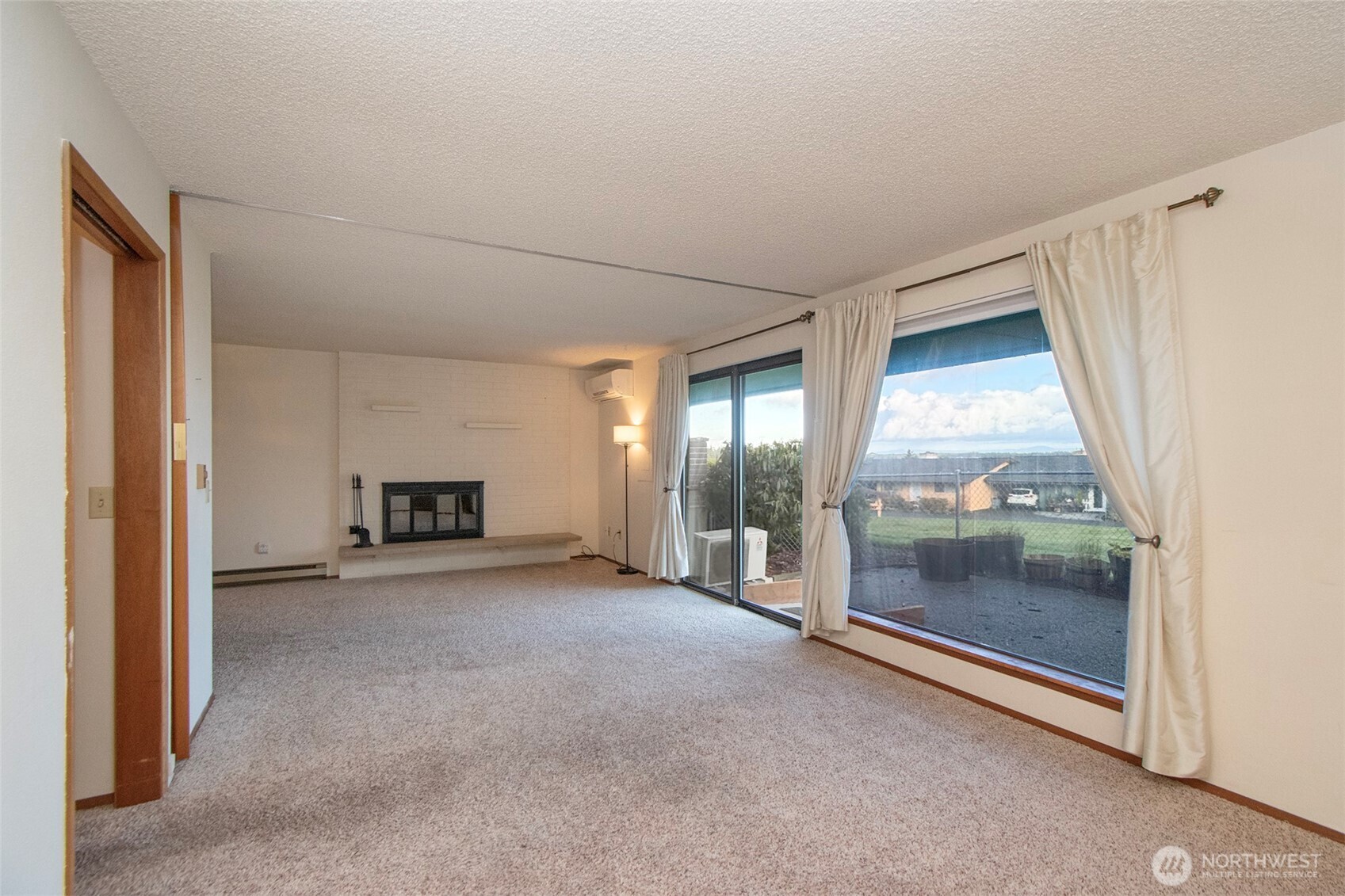 1301 South 3rd Avenue, Unit 9B Sequim, WA 98382 - Photo 16 of 39 a view of a room with an empty room and fireplace