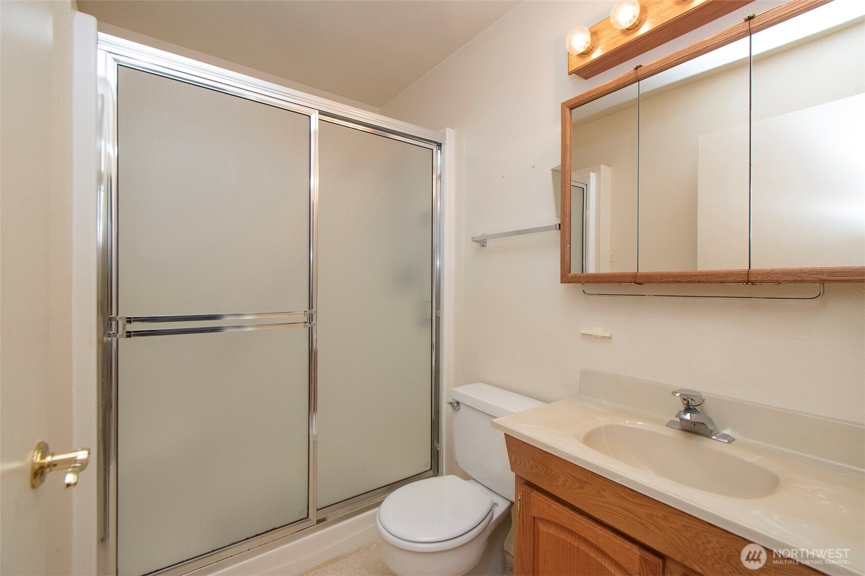 1301 South 3rd Avenue, Unit 9B Sequim, WA 98382 - Photo 25 of 39 a bathroom with a sink a toilet and shower