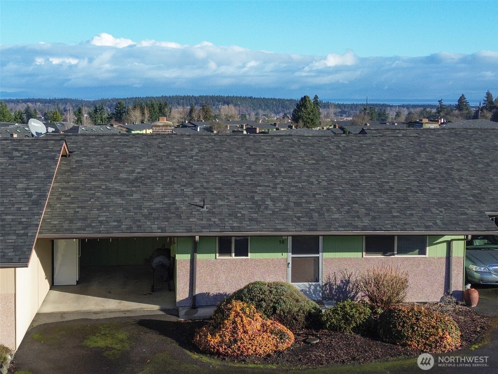 1301 South 3rd Avenue, Unit 9B Sequim, WA 98382 - Photo 26 of 39 a view of a terrace with a garden