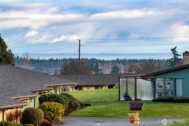 a view of a terrace with yard and outdoor seating