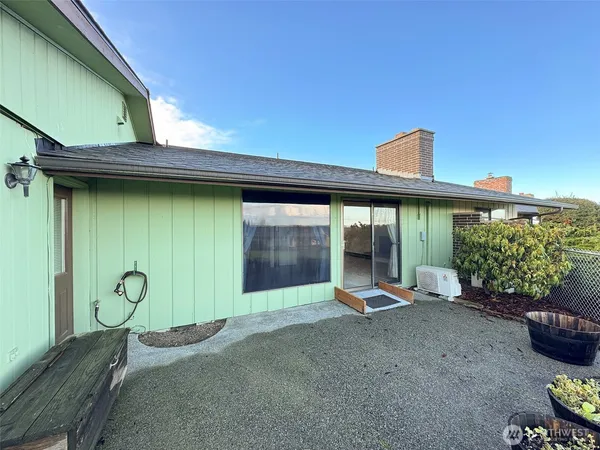 a view of a backyard with hardwood area and porch