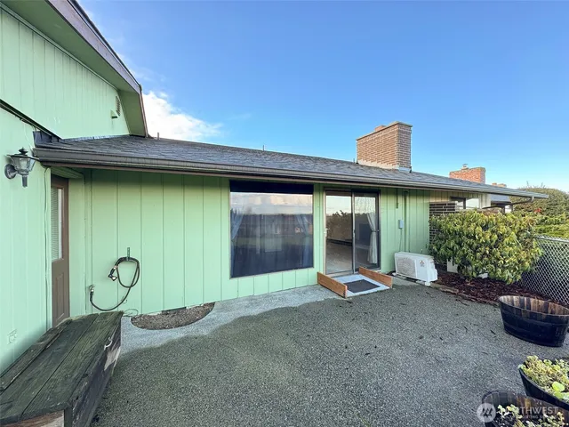 a view of a backyard with hardwood area and porch