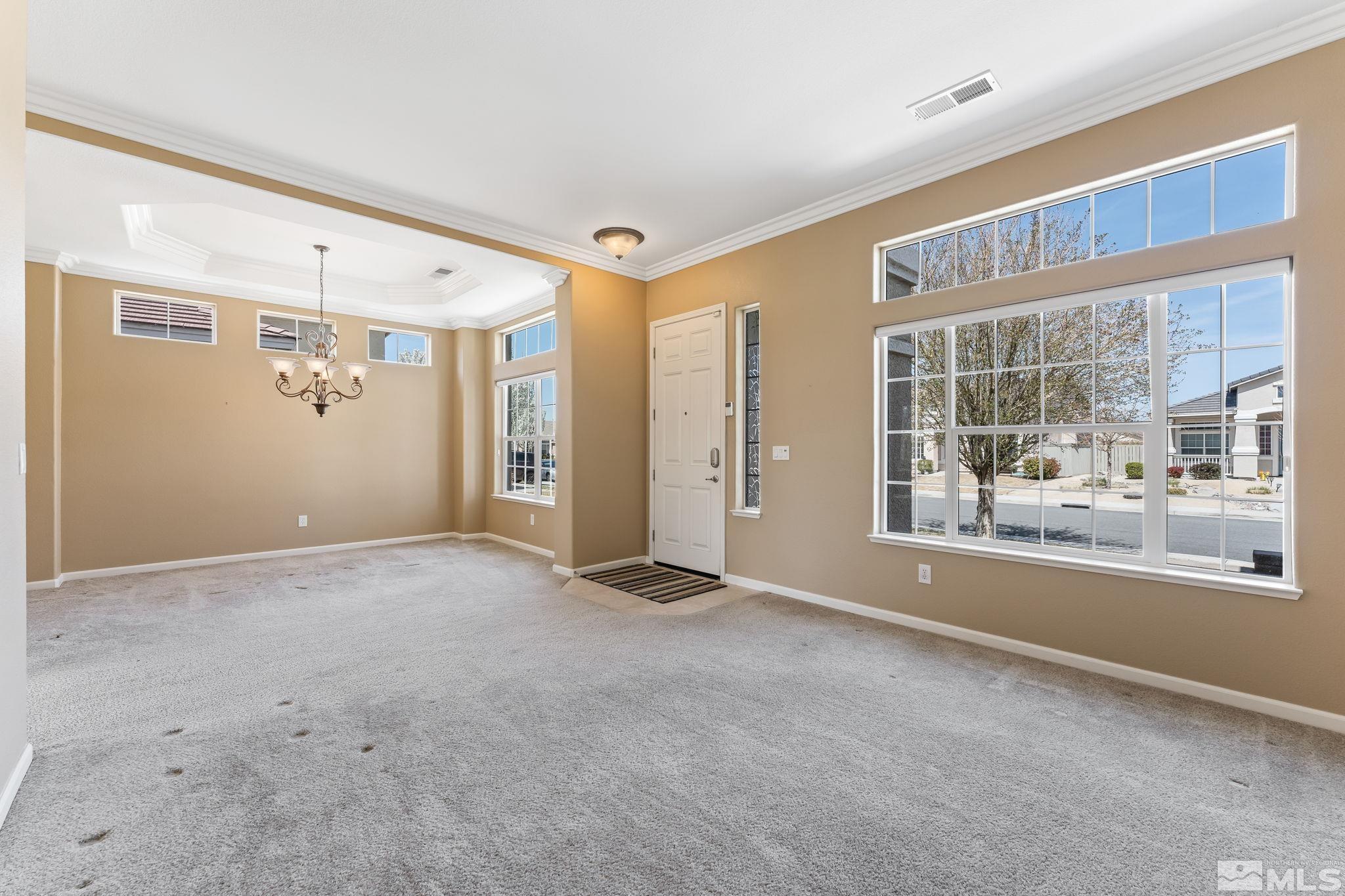 1620 Murrieta Court Reno, NV 89521 - Photo 4 of 28 a view of a big room with windows and chandelier