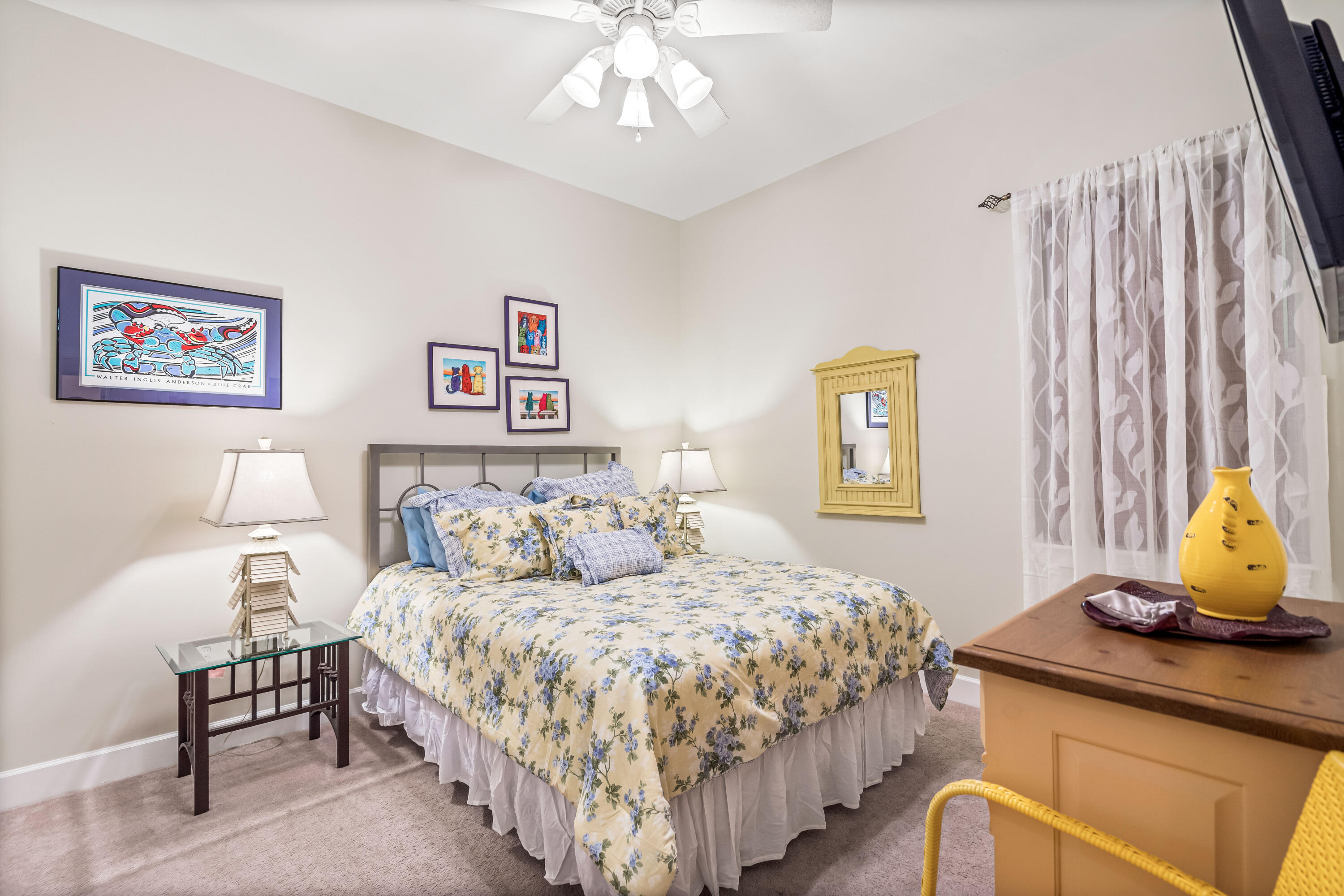 231 Somerset Bridge Road, Unit 1208 Santa Rosa Beach, FL 32459 - Photo 6 of 37 a bedroom with a bed and a chandelier