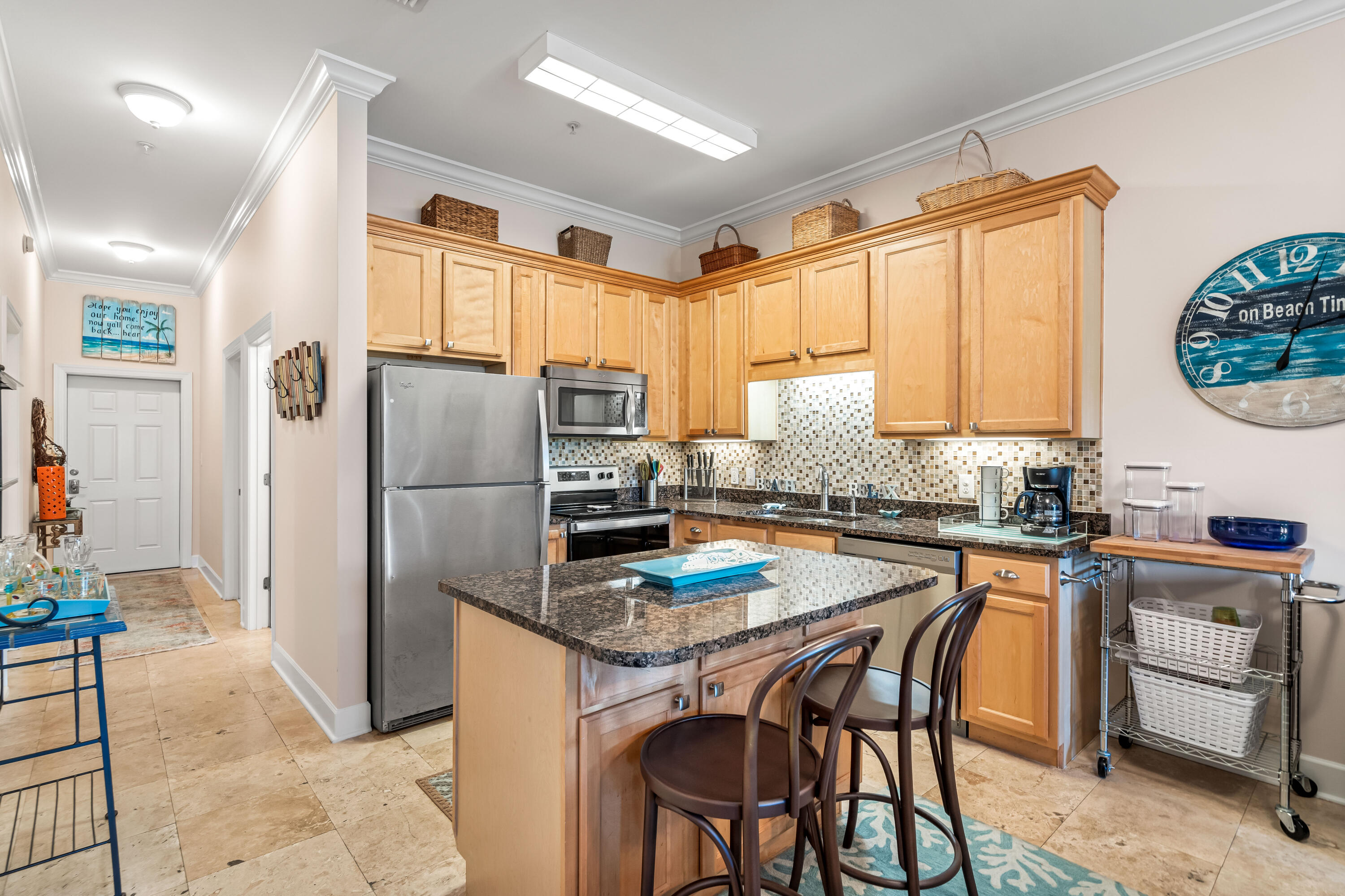 231 Somerset Bridge Road, Unit 1208 Santa Rosa Beach, FL 32459 - Photo 10 of 37 a kitchen with a refrigerator a stove a sink and a dining table