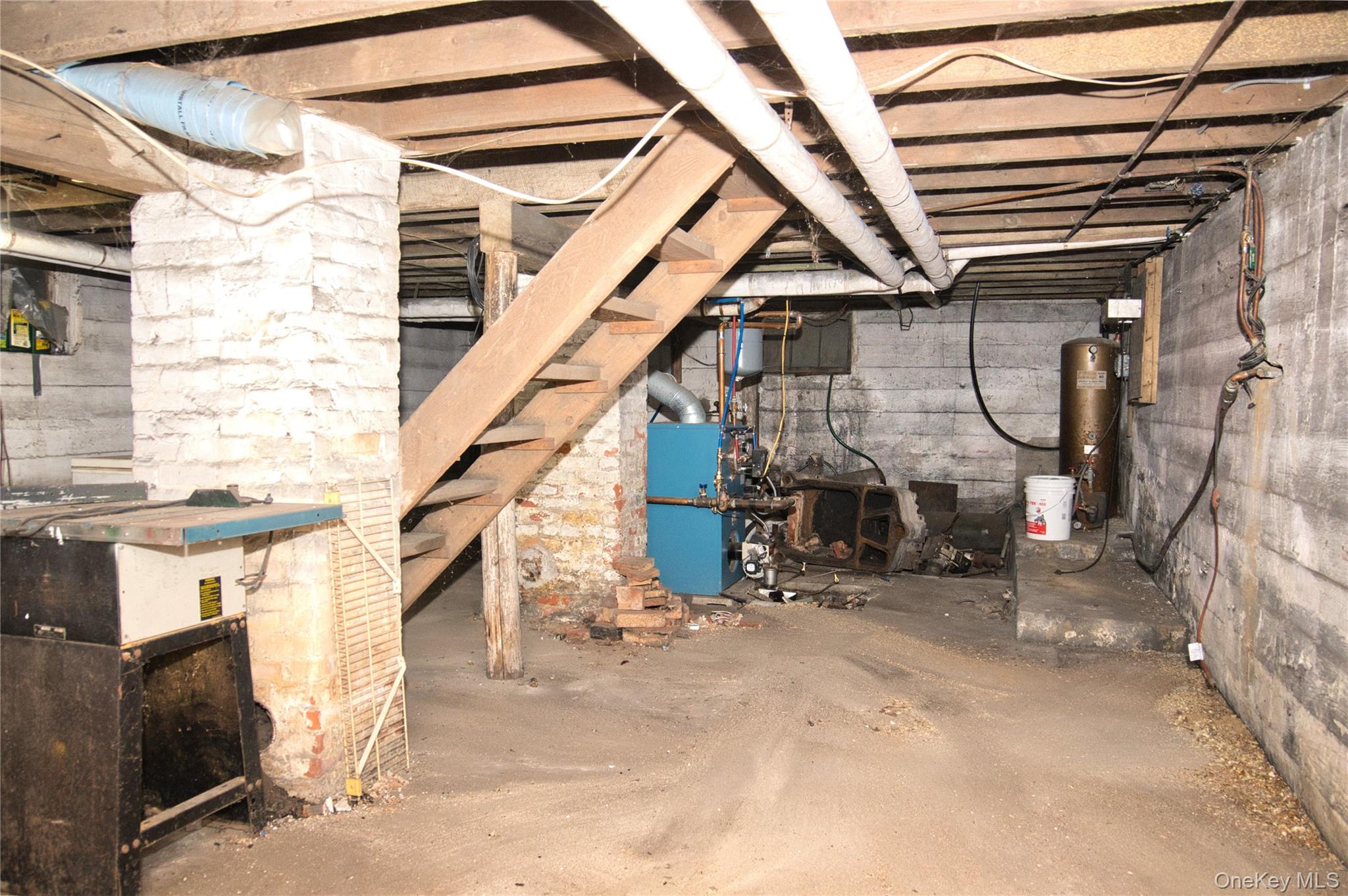 256 Round Hill Road Florida, NY 10921 - Photo 11 of 14 Unfinished basement with a heating unit and gas water heater