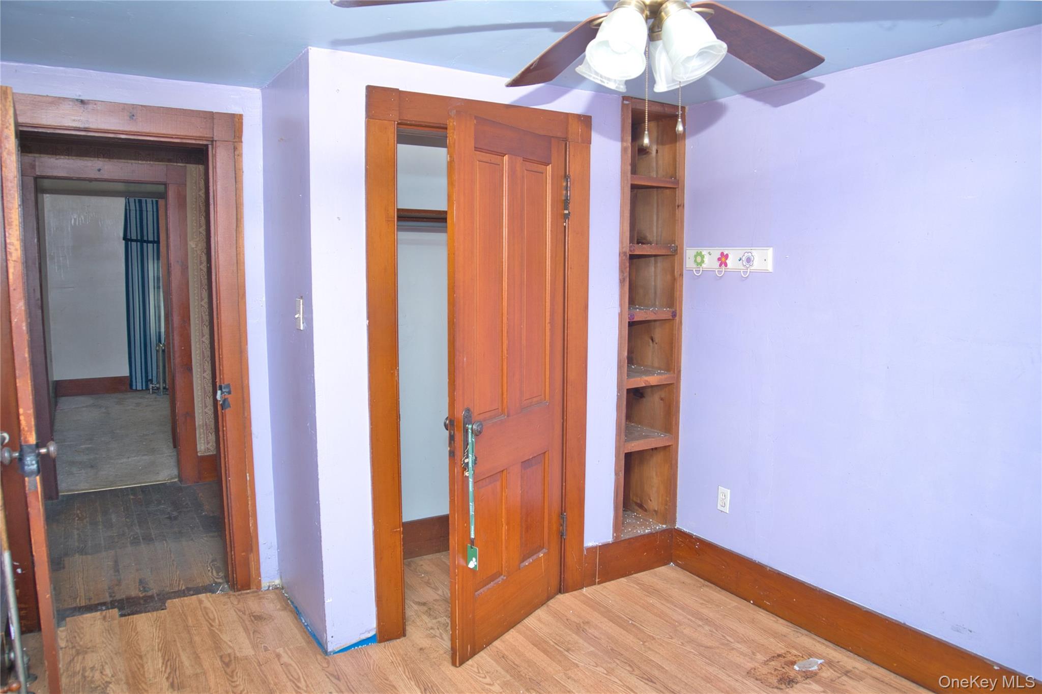 256 Round Hill Road Florida, NY 10921 - Photo 9 of 14 Unfurnished bedroom featuring light wood finished floors, a closet, and a ceiling fan