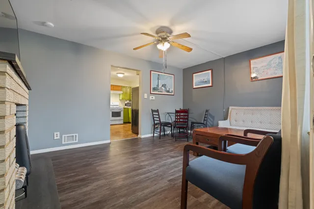 a view of a livingroom with furniture and wooden floor