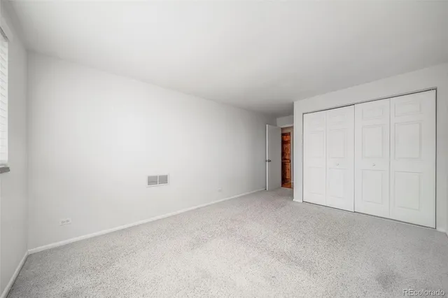 a view of an empty room and entryway