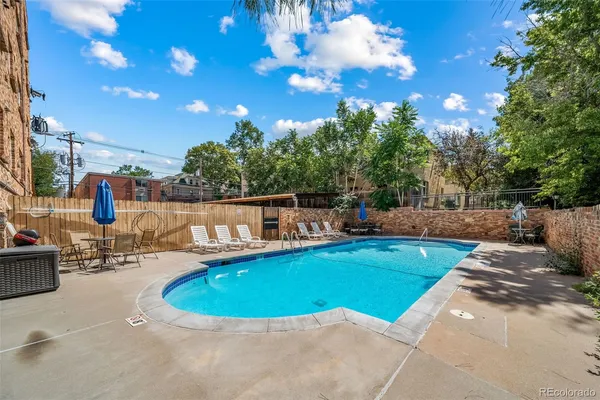 a view of a swimming pool with a patio