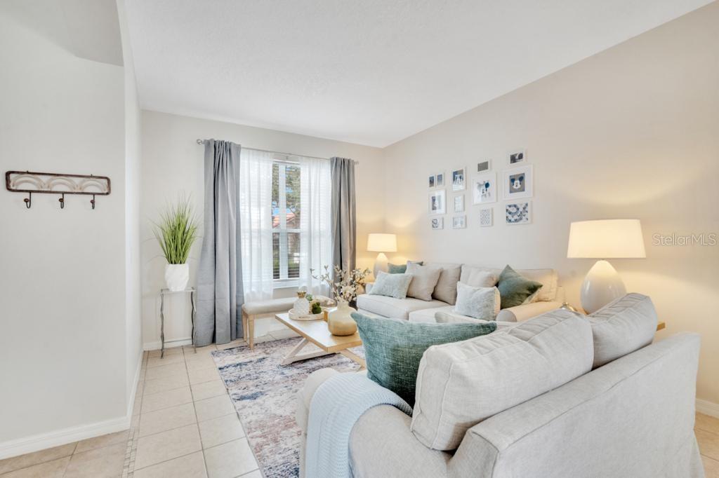 162 Cordova Avenue Davenport, FL 33897 - Photo 11 of 80 a living room with furniture and a window