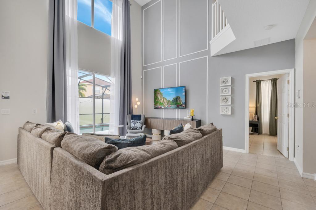 162 Cordova Avenue Davenport, FL 33897 - Photo 25 of 80 a living room with furniture and a flat screen tv