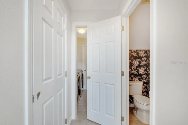 a bedroom with a bed and a mirror