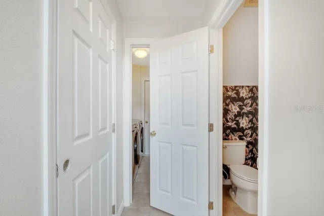 a bedroom with a bed and a mirror