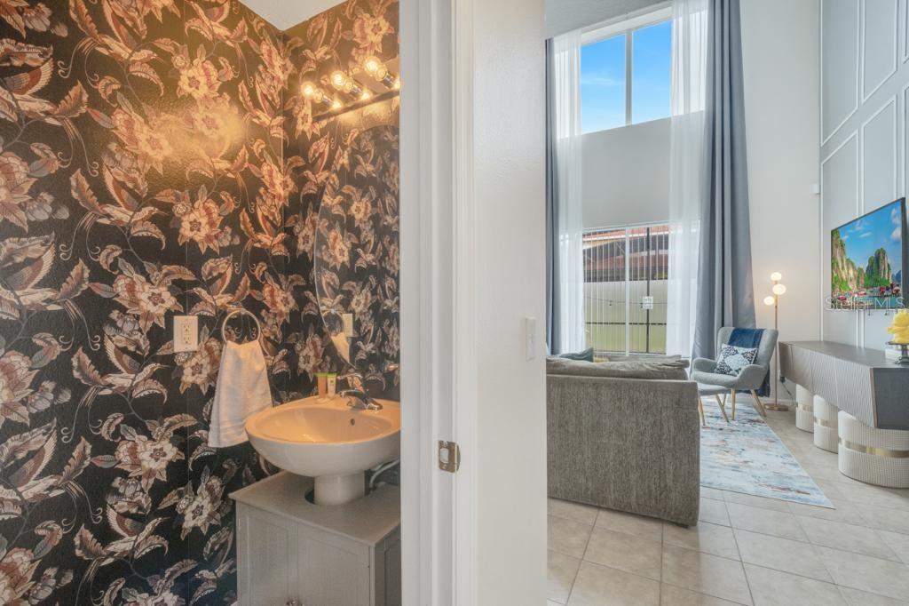 162 Cordova Avenue Davenport, FL 33897 - Photo 29 of 80 a bathroom with a toilet and a sink