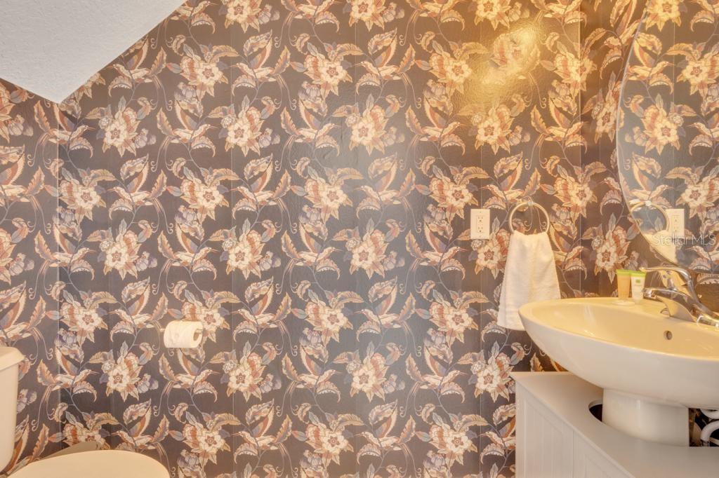 162 Cordova Avenue Davenport, FL 33897 - Photo 30 of 80 a bathroom with a sink and a toilet