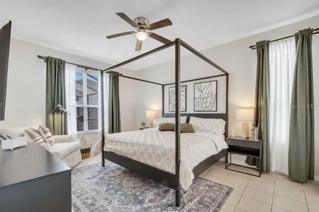 a bedroom with a bed and a table in it