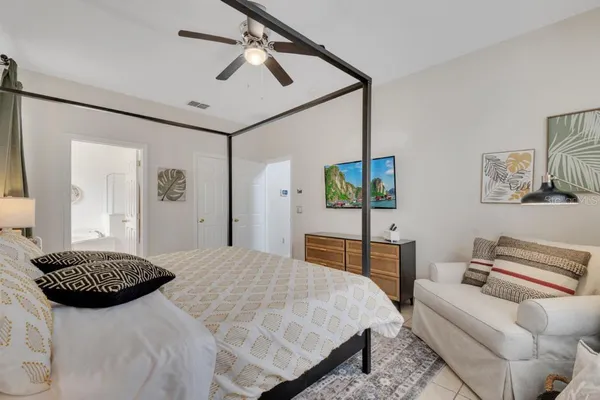 a bedroom with a bed and a table with closet