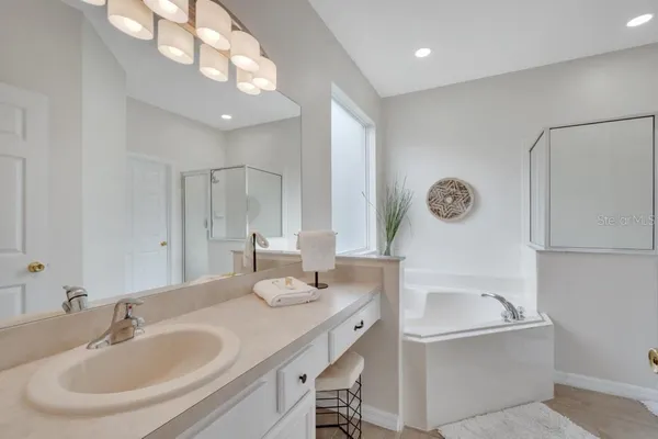 a bedroom with a bed and a lamp