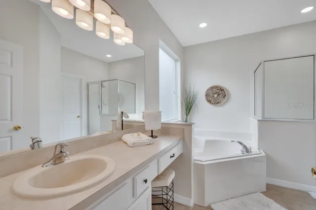 a bedroom with a bed and a lamp