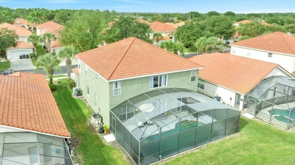 a aerial view of a house with a yard