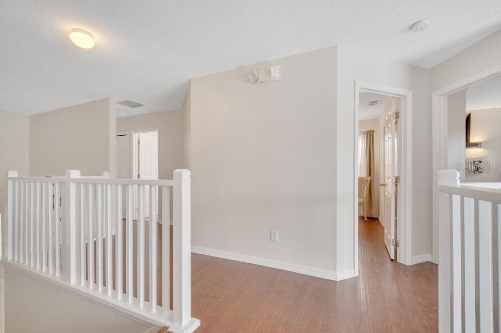 162 Cordova Avenue Davenport, FL 33897 - Photo 57 of 80 a view of a hallway with wooden floor and entryway
