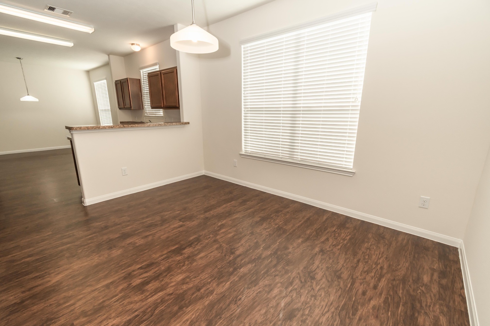 20 Lazy Swing Court Manvel, TX 77578 - Photo 4 of 14 a view of a kitchen with wooden floor and a sink