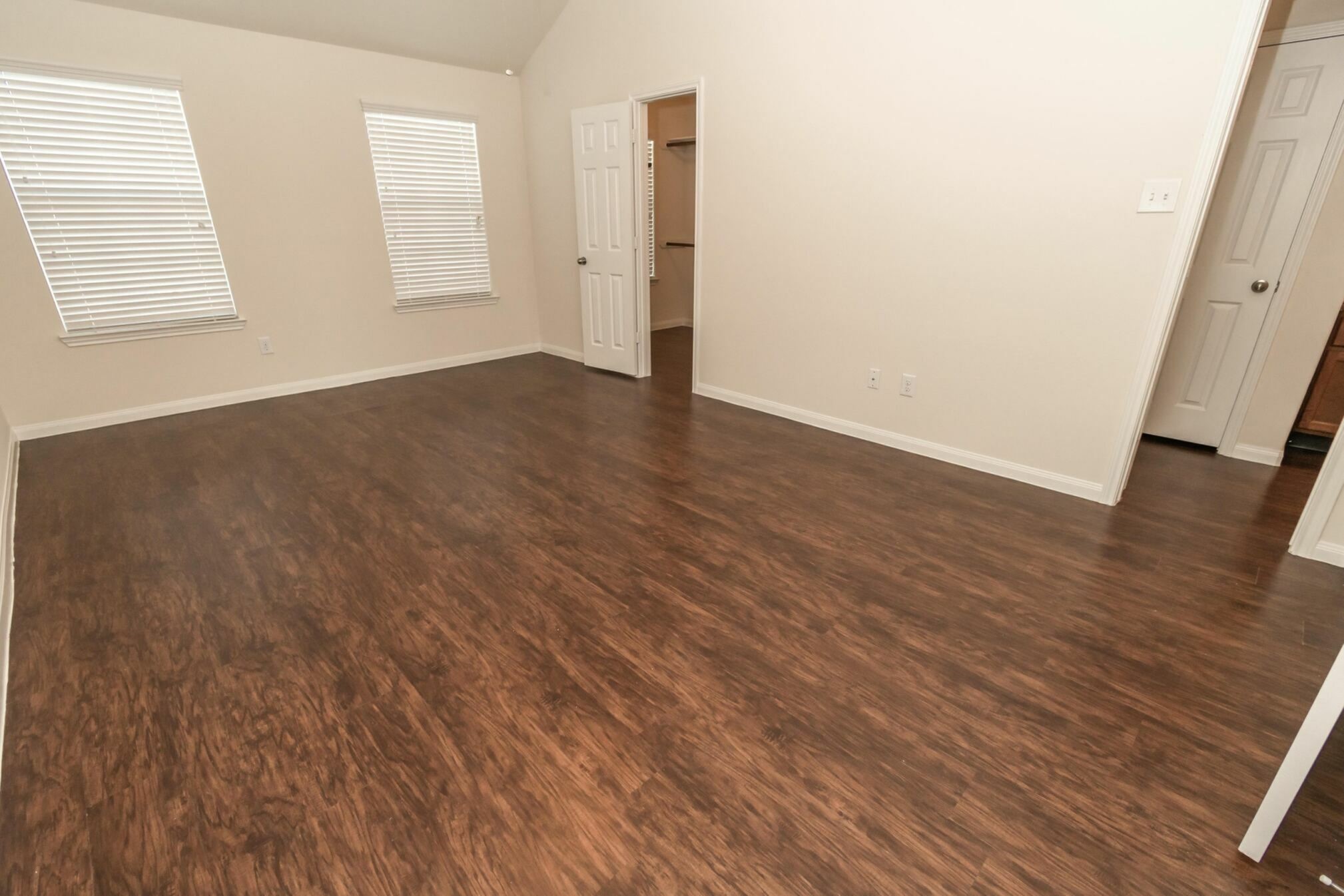 20 Lazy Swing Court Manvel, TX 77578 - Photo 10 of 14 an empty room with wooden floor and windows