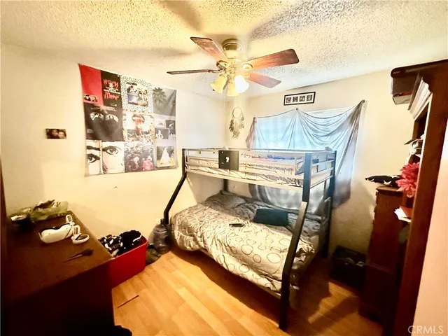 a bed room with a bed and a window