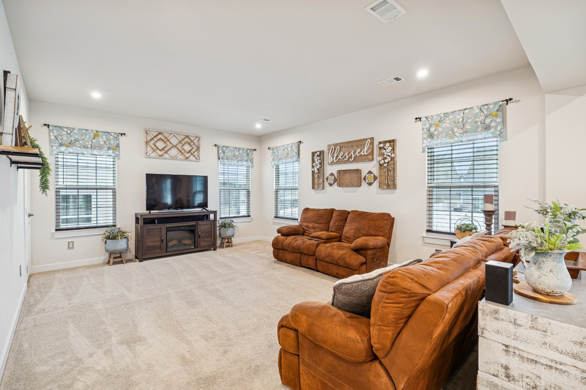 809 Mill Tree Court Smyrna, TN 37167 - Photo 13 of 42 a living room with furniture a flat screen tv and a large window