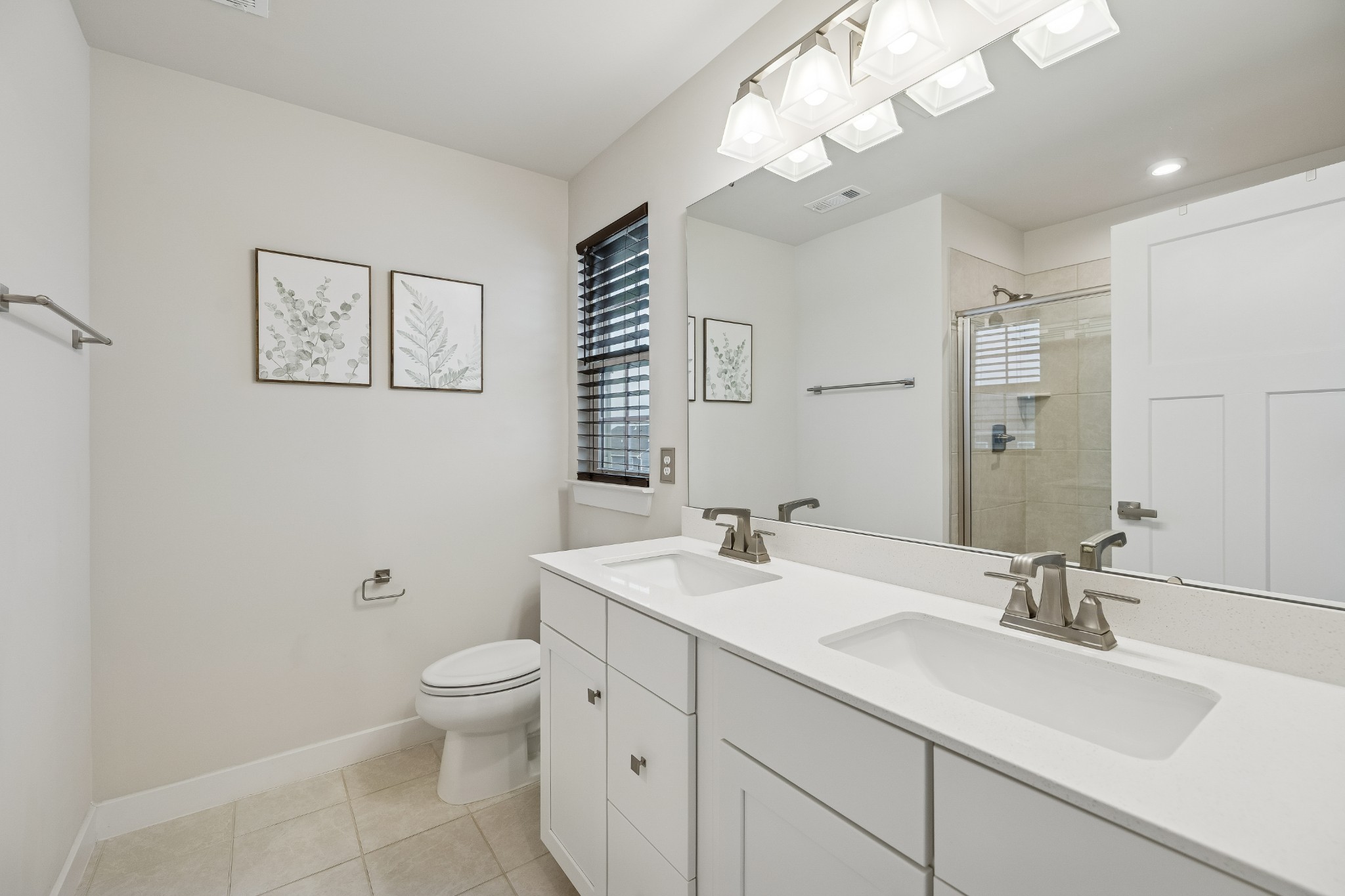 809 Mill Tree Court Smyrna, TN 37167 - Photo 23 of 42 a bathroom with a toilet a sink a mirror a vanity and window