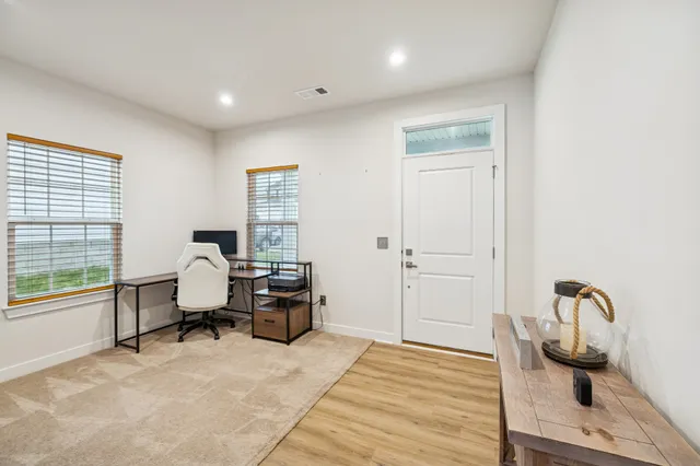 a workspace with furniture and a window