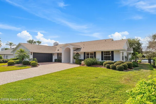 a living room with furniture fireplace and dining table