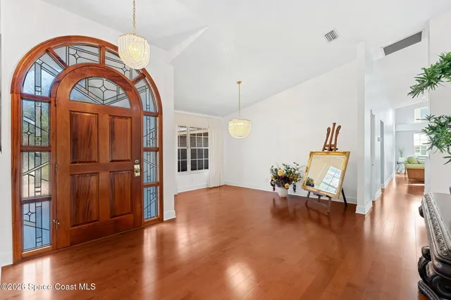 a vase of flowers sitting on a table with a window