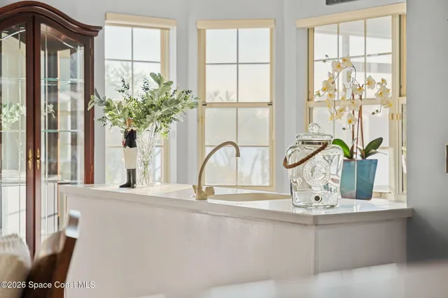 a view of a backyard with wooden fence